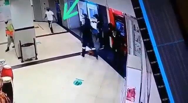 Moment security officer walked away unconcerned as robbers takeover store (Video)