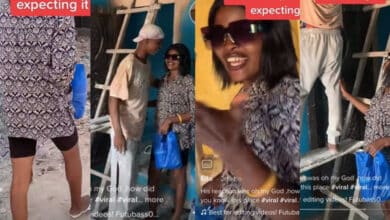 "See love wey I dey find" - Reactions as lady surprises painter boyfriend with food at work