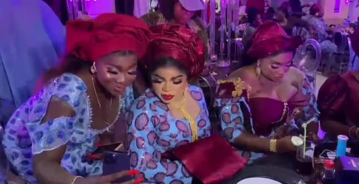 Bobrisky taking photos with a fan at Alesh Sanni's birthday party