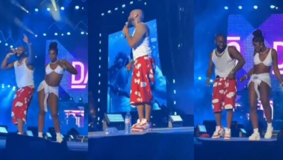 Davido pictured with lady on stage