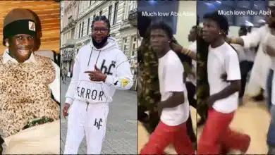 "Poor man pikin go think say na bouncer" - Reactions as Abu Abel protects Seyi Vibez at event