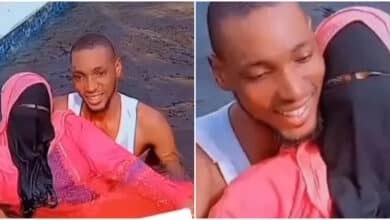 "Eti ya Werey" - Reactions as man goes swimming with his Niqobite Muslim wife