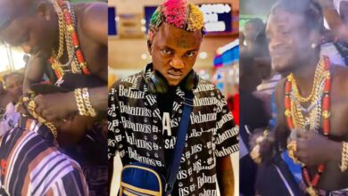Portable distributes gold necklaces purchased on his U.S. tour to record label artists at Lagos bar 