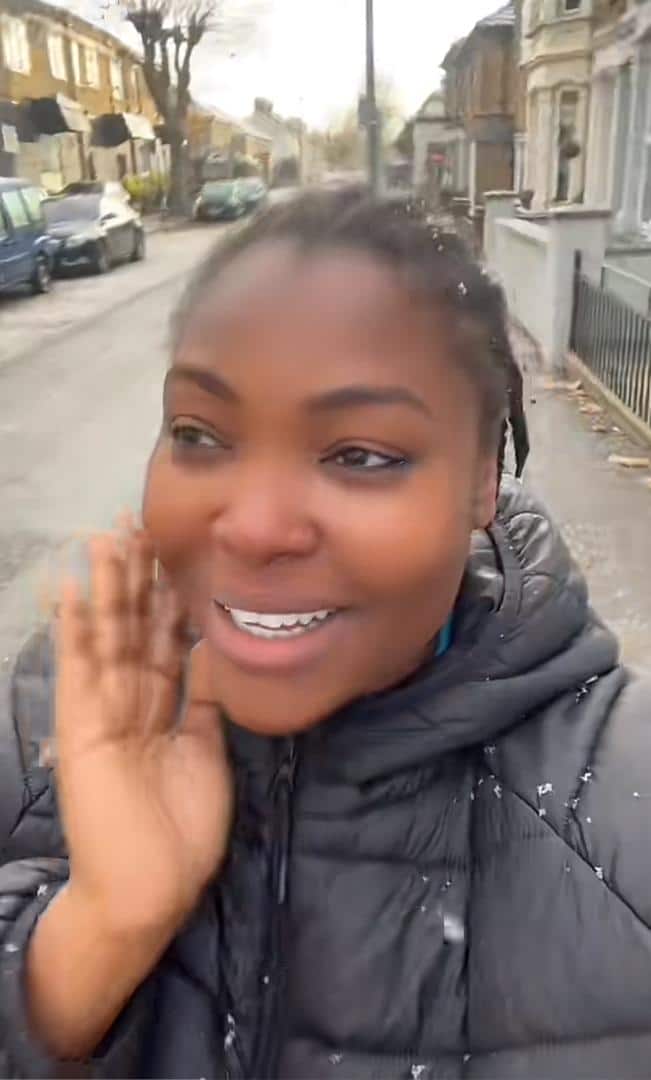 "Officially I'm in the abroad" - Nigerian lady overjoyed as she sees snow for the first time