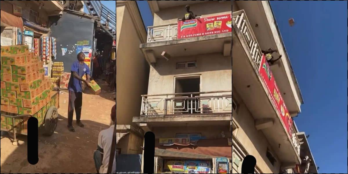 Man loads packs of goods to two-story building by flinging in the air