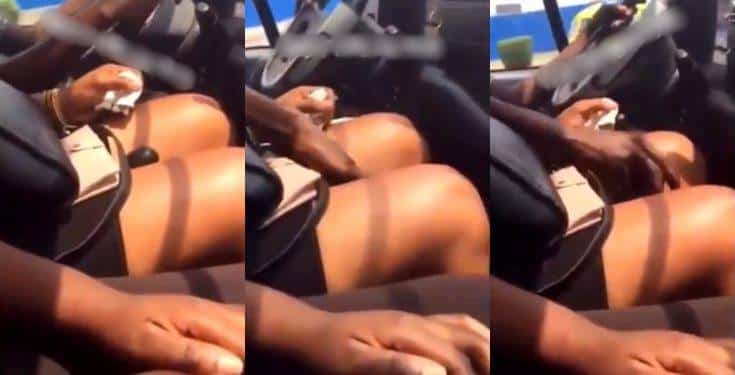 Driver seen changing gear between the laps of a female passenger (video)