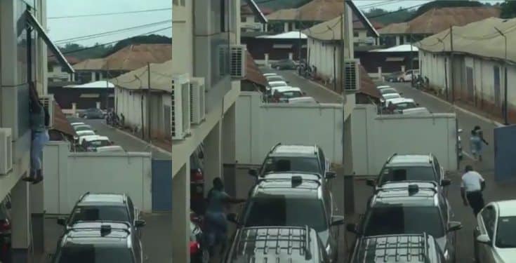 Lady jumps down from window after robbing a bank (video)