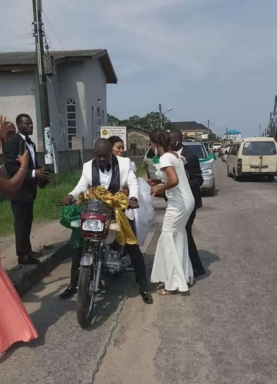 Couple ride bike home after their wedding party in Port Harcourt