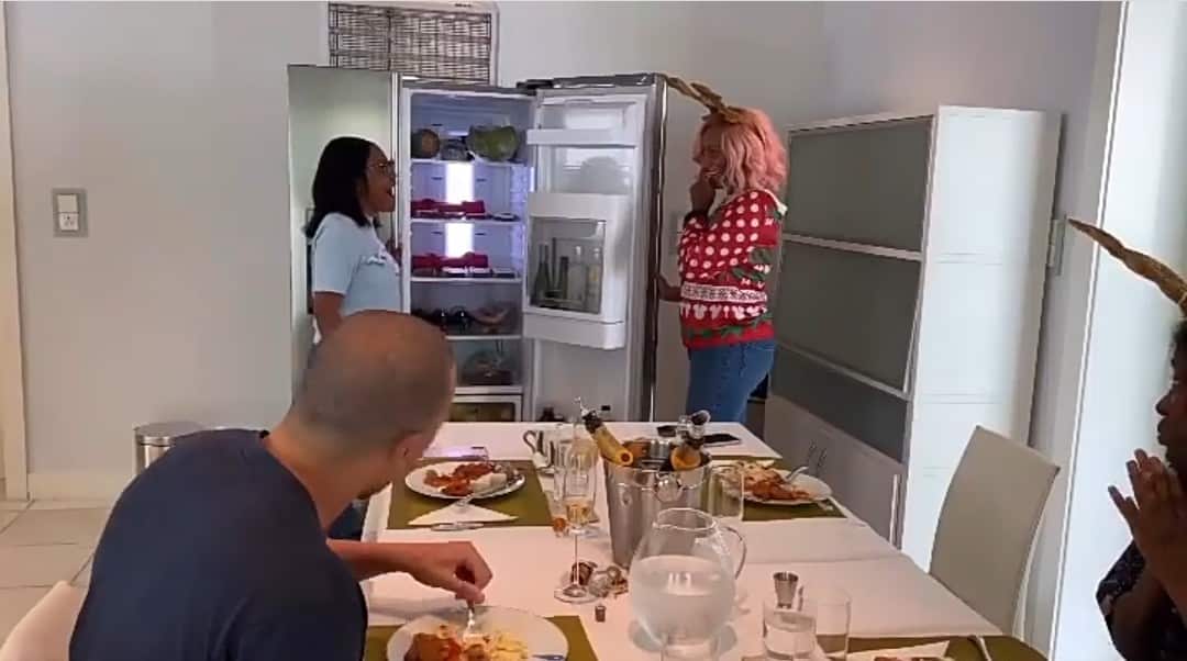 DJ Cuppy stacks N500k in a fridge to gift her manager, Elizabeth (Video)