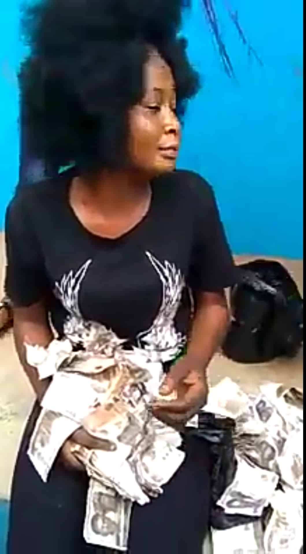 Lady caught trying to deposit N200k fake currency notes at a POS store in Benin (Video)