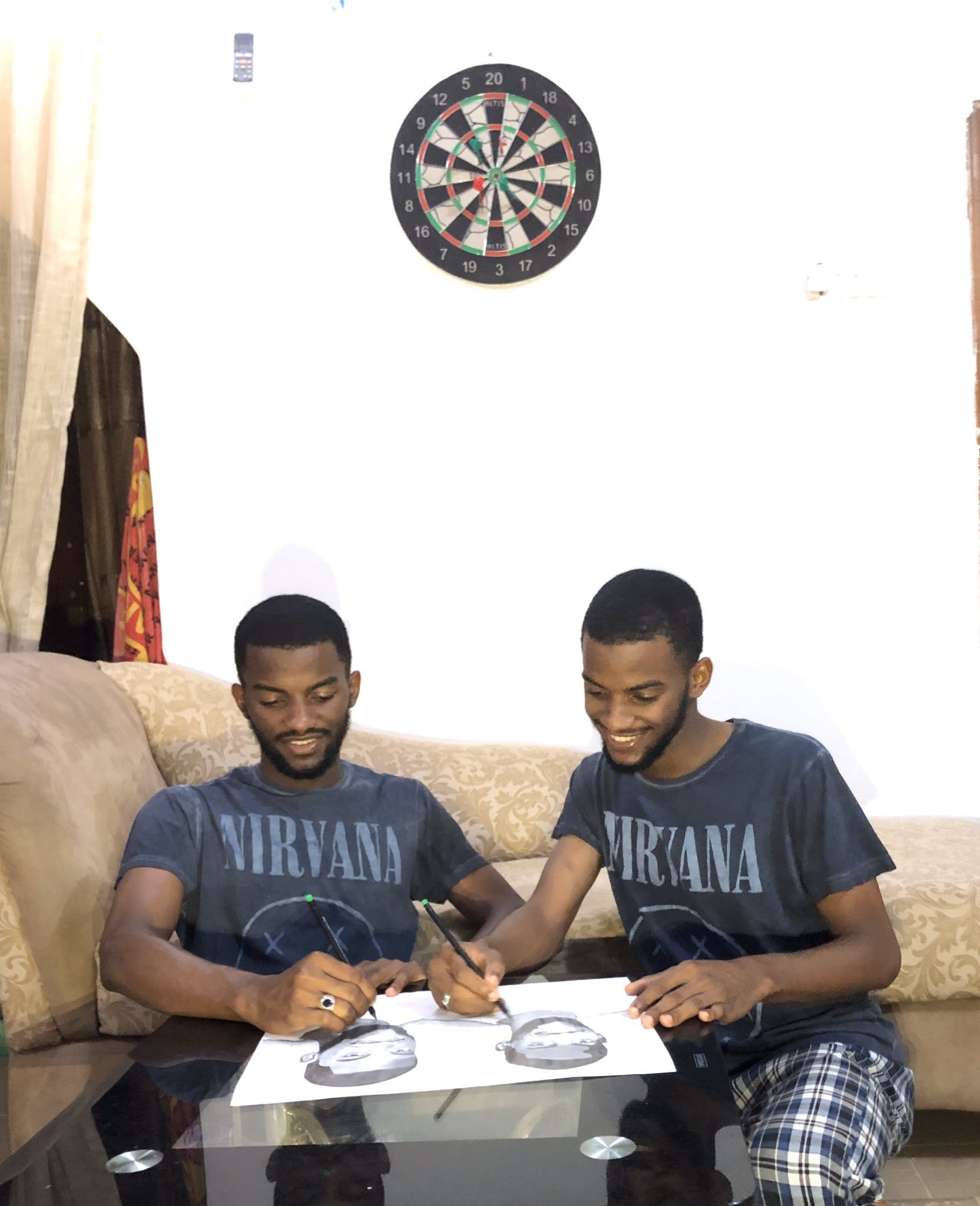 Talented twins draw themselves