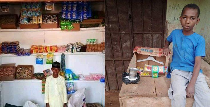 Primary school pupil poses in front of his "Shopping Complex" in Kano