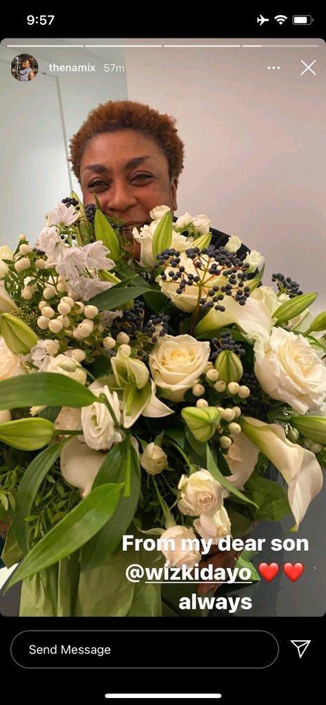 burna boy's mother, bose ogudu receives flowers from wizkid