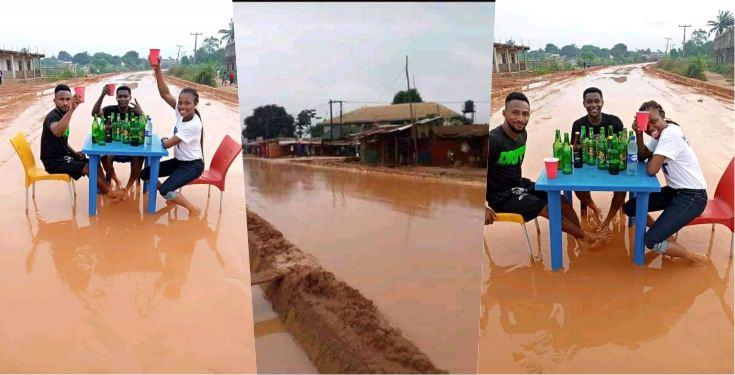 "In celebration of bad road" - Says residents of nekede Imo state as they drink beer on muddy road