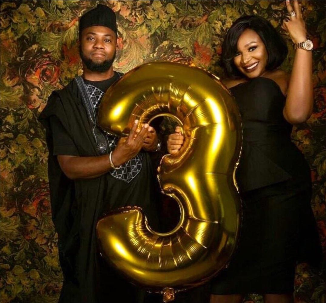 couples holding a balloon while celebrating wedding anniversary