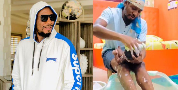 Junior Pope shares video showing himself giving his son a warm bath