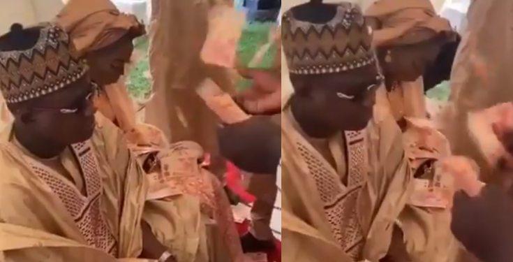 Nigerians react to viral video of couple being sprayed ₦10 notes by their friends at their wedding