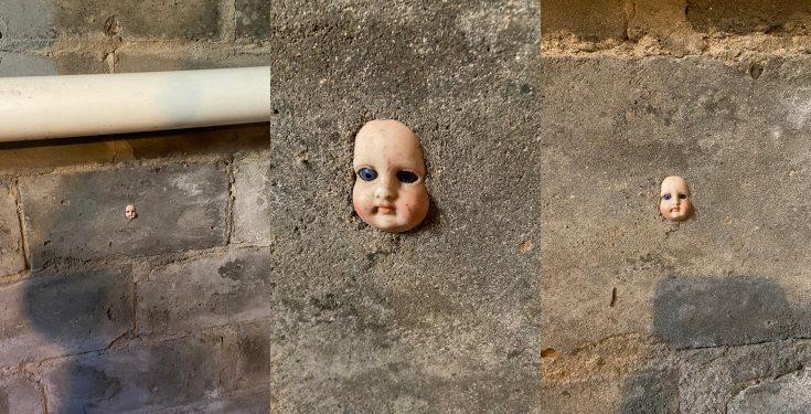 Woman finds head of a doll stuck in her basement wall