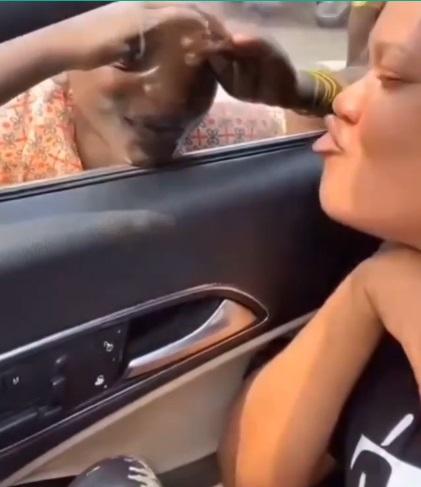 Reactions as Toyin Abraham blows child beggar kiss in traffic (Video)