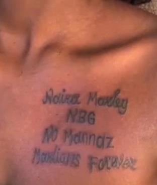 Naira Marley applauds Cameroonian who tattooed his name on her chest (Video)