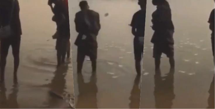 Moment yahoo boys were spotted spraying money into river (Video)