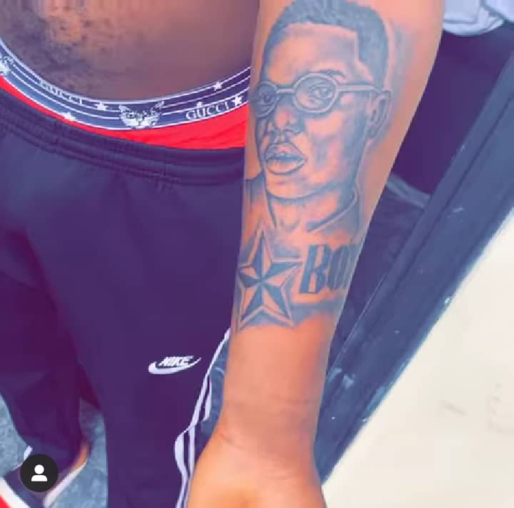 Wizkid's face tattooed on his arm