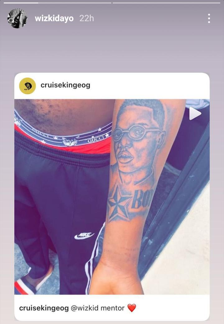 Wizkid's face tattooed on his arm