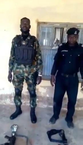 Police Officer becomes laughing stock after struggling to assemble gun while competing with Soldier (Video)