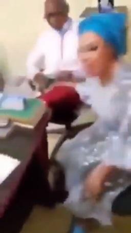 Man calmly watches as wife and side chick fight dirty in DPO's office (Video)
