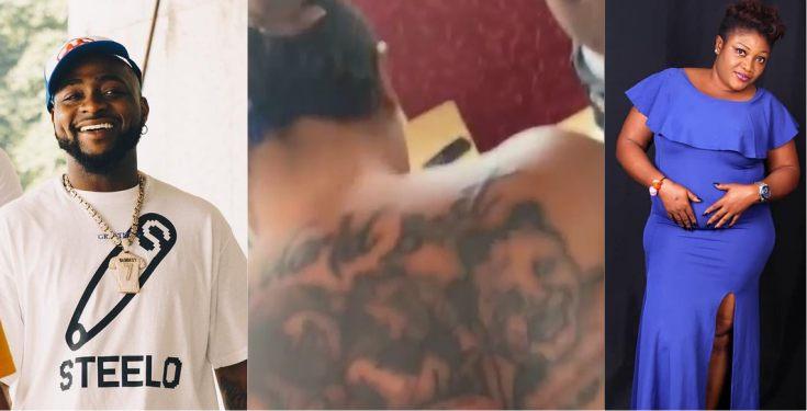 Davido reacts as lady tattoos his face and that of all his children on her back