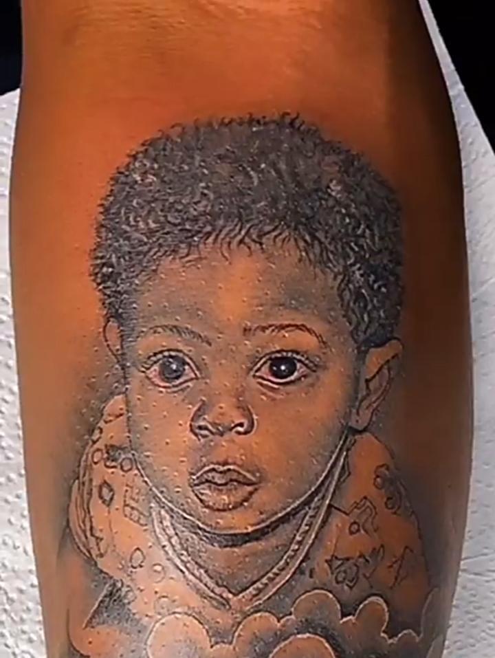 Praise gets tattoo of his son on his arm