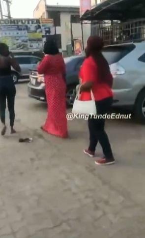 "Leave my husband alone" -  Woman calls out husband's side chick in public (Video)