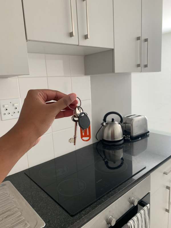 Lady celebrates as she acquires new apartment and car within a year