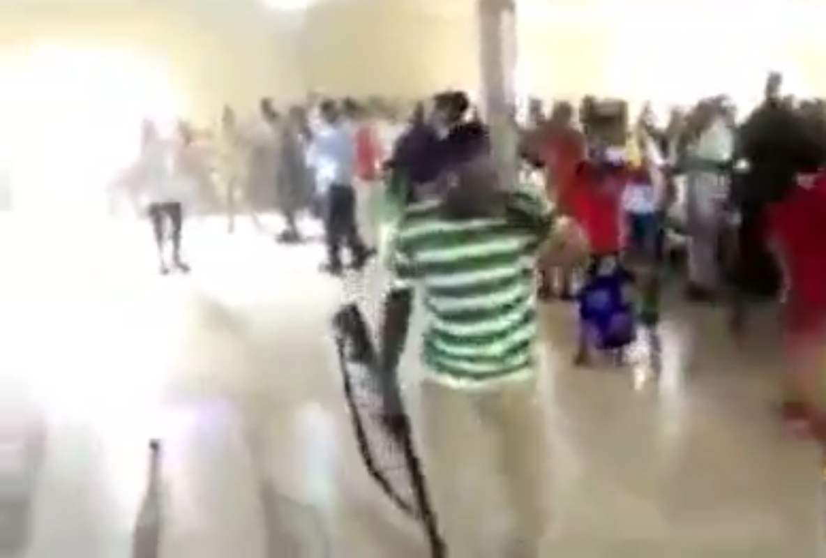 Watch church members praying with guns, cutlasses, other weapons to fight devil (Video)