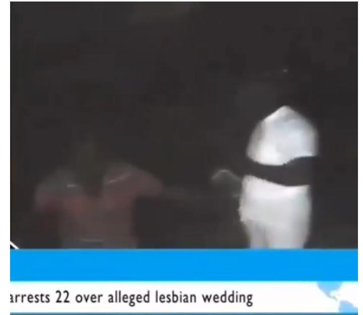 Police officers arrest lesbians