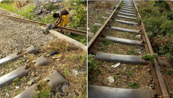 man cutting train rail