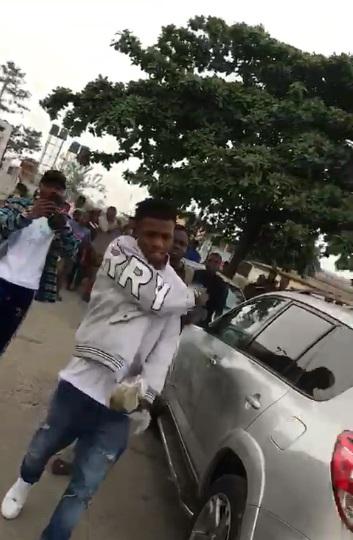 Suspected yahoo boy spotted spraying stash of money after final exams (Video)