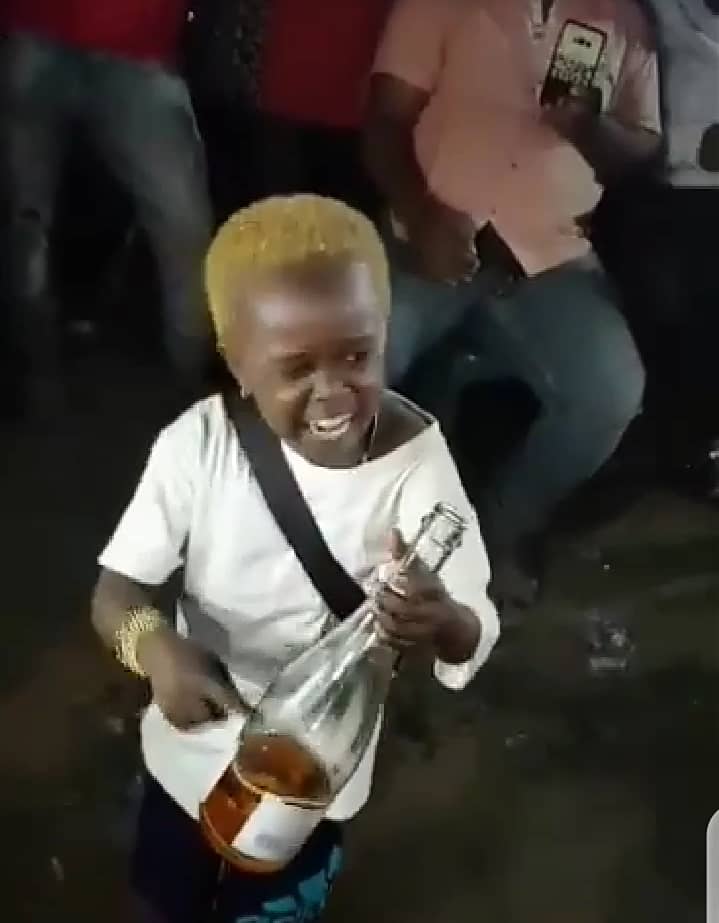 "Allow me to enjoy myself" - Little boy screams while consuming bottle of alcoholic drink amid cheers (Video)