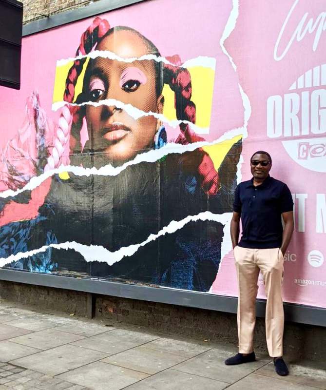  Femi Otedola pose beside DJ Cuppy's billboard