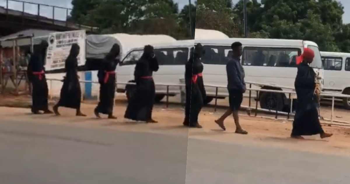 Suspected yahoo boys spotted in black robes marching in daytime (Video)
