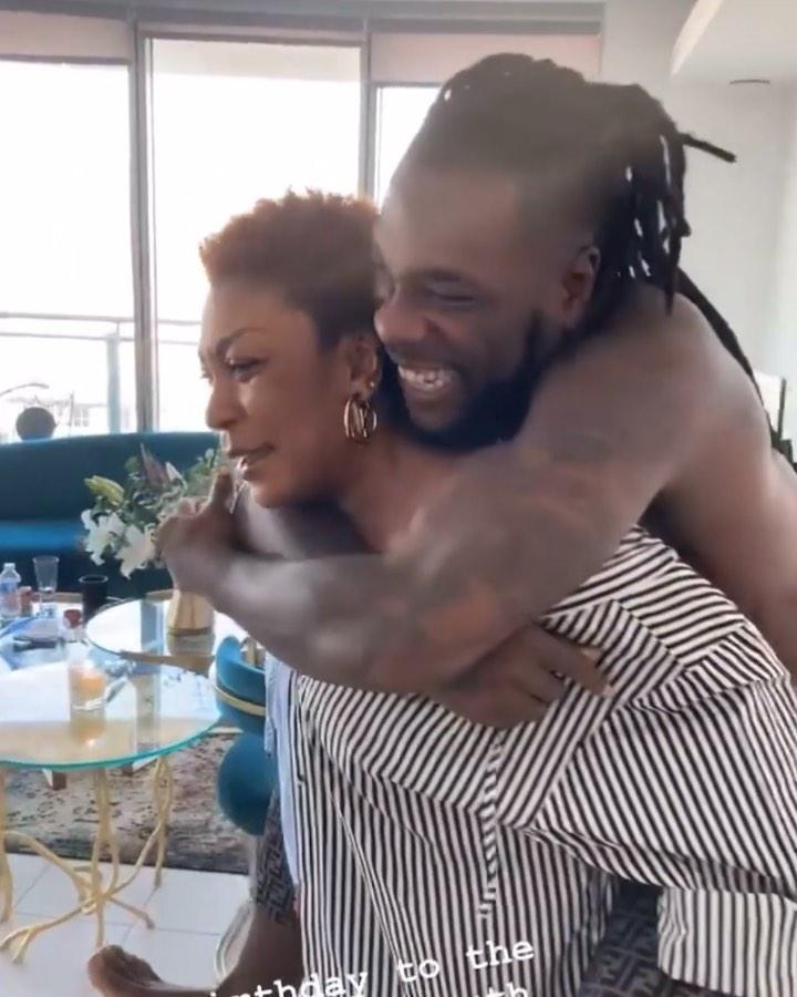 "You've lost weight" - Moment Burna Boy's mother carried Odugwu on her back on his 30th birthday (Video)