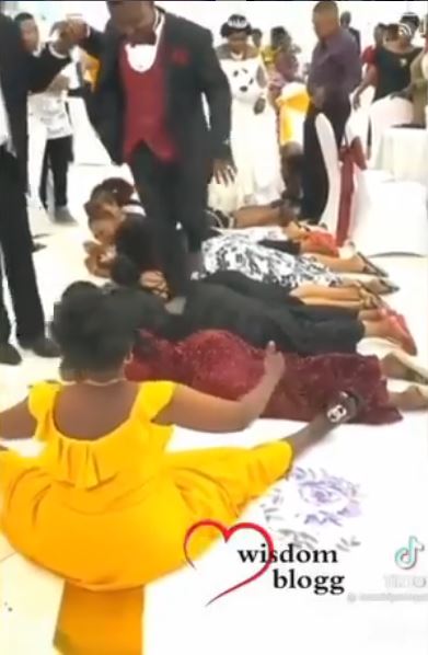 Couple Backs Guests Wedding