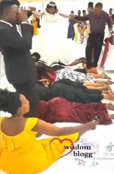 Couple Backs Guests Wedding