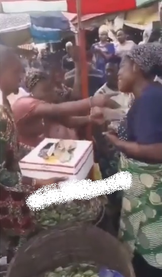 Man surprises mother who sells okra with birthday serenade at market (Video)