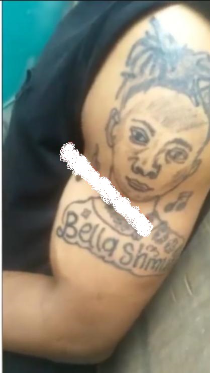 "This wan na isabella" - Reactions as fan ink tattoo of Bella Shmurda's face (Video)