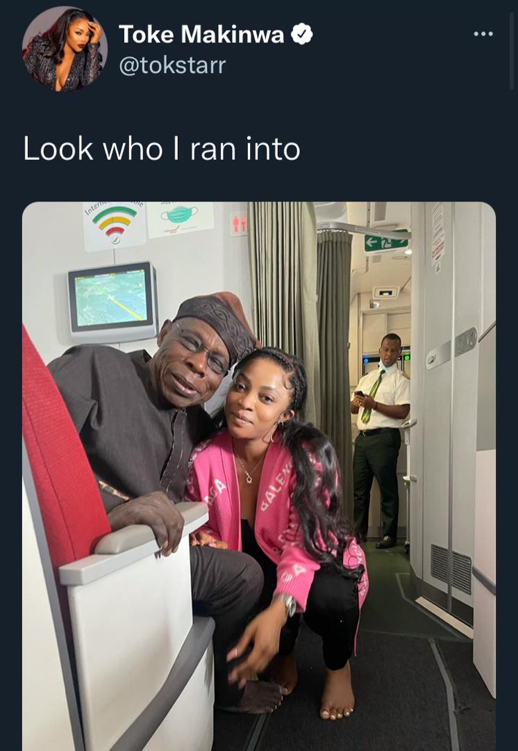 Toke Makinwa dragged over selfie with ex-president, Obasanjo, barefooted on private jet