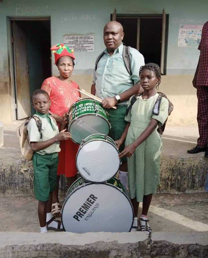 Moment Man Appears In School Uniform, Donates Bags, Drums To Schoolchildren [Photos]