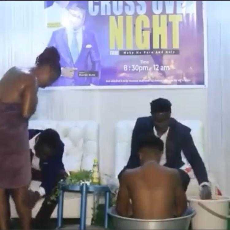 Pastor bathes female church members on altar during cross over night (Video)
