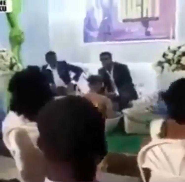 Pastor bathes female church members on altar during cross over night (Video)