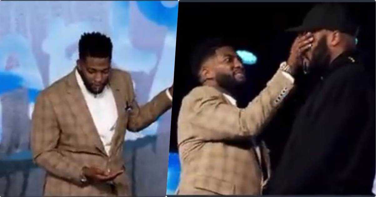 Pastor massages his saliva on face of member to prove a point about his preaching (Video)